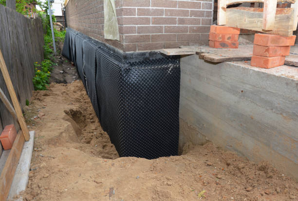 SJ Waterproofing Pros technician performing targeted Interior Drainage System assessment in Albertville, AL